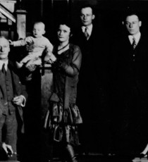 Forty-five years after the founding of the Club, first President Thomas Burgess stands at left for a family portrait in Colonel Alexander B. Crane’s entrance hall.
 