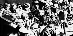 The lucky one's have seats at the 1977 Nationals at FMTC. Rear: Martin Bowen, Vail Traina, Lois Hebard, Bette Otto, Mike North, Hank Otto. Middle: Molly Ware, Al Traina, Judy and Ron Durning (following man in cap), Bob Rau. Front: John Ware